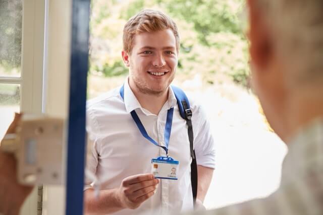 Carer arriving at a service user's door - maintaining independence with home care