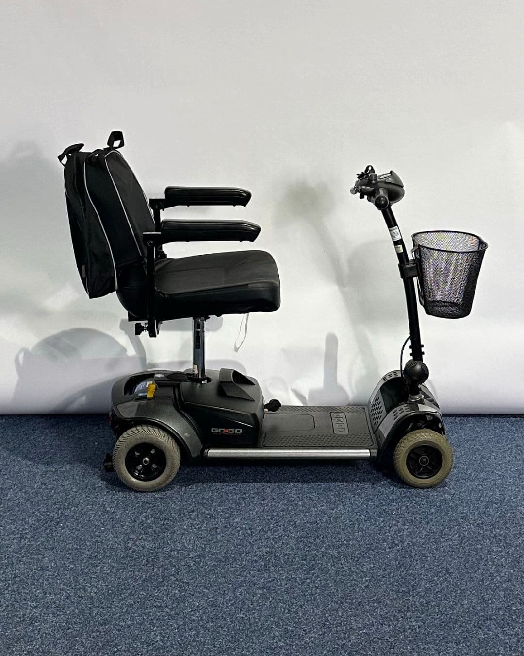 Approved Used Pride Go Go Elite Traveller in grey, with 12 ah batteries and mesh basket