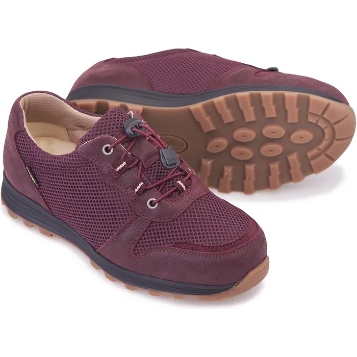 A pair of Cosyfeet Misty in Aubergine one shoe lying on its side showing the sole.