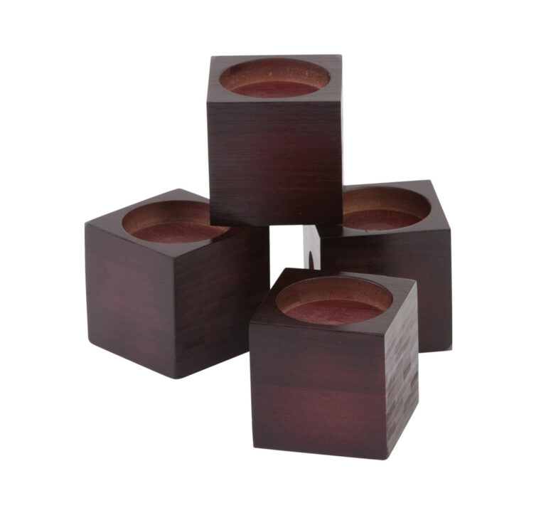 A set of Drive 3'' Wooden Chair Raisers. Three of the blocks are sitting below with one stacked on top. On a white background.
