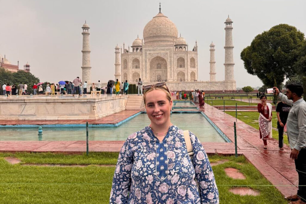 Premier Community Carer Tia, stood in front of the Taj Mahal
