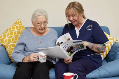 Premier Community Carer talking through home care options with a service user