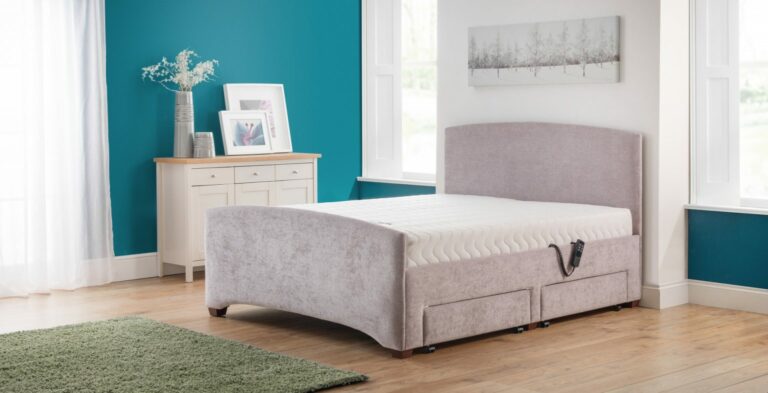 Elegant bedroom with a teal accent wall features a plush gray Custom Retford Double bed with storage drawers, natural light streaming through large windows, and a cozy, modern vibe.