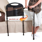 Stander Mobility Bed Rail close up connected to a bed with a person on the side gripping the Stander Mobility Bed Rail.