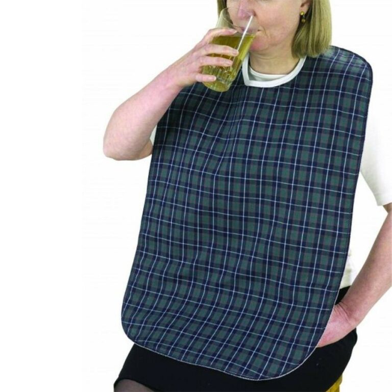A woman wearing the Dinner Bibs while drinking a drink on a white background.