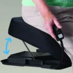 A person sitting upon a Uplift Powered Lifting Cushion with a arrow indicating the movement of the Uplift Powered Lifting Cushion
