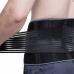 A topless male model facing backwards from the camera wearing Kedley Aero-Tech Neoprene Advanced Back Support
