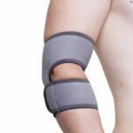 A male topless model wearing the AB - Kedley Pro-Light Neoprene Elbow Support 2.