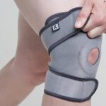 A model wearing a Kedley Pro-Light Neoprene Knee Support