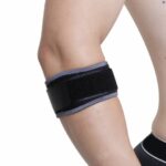 Kedley Aero-Tech Neoprene Tennis Elbow Support on a topless version, wrapped around a forearm, just below the elbow on a white background.