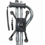 Folding Quad Cane - a metal walking stick with a handle, folded up completely sitting on a white background.