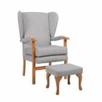 Jubilee Fireside Chair and footrest on a white background