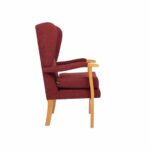 Jubilee Fireside Chair Red Side View on a white background.