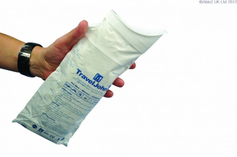 Travel John Disposable Urinal urinal being held by a hand against a white background.