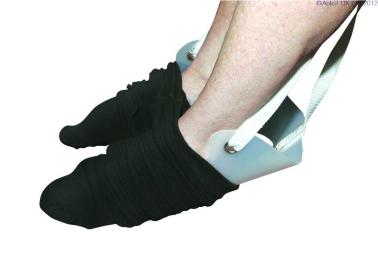 Tights Aid being used by a person using it to put on black tights.