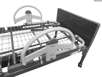 Stander EZ Click Bed Rail connected upon a black bed frame.