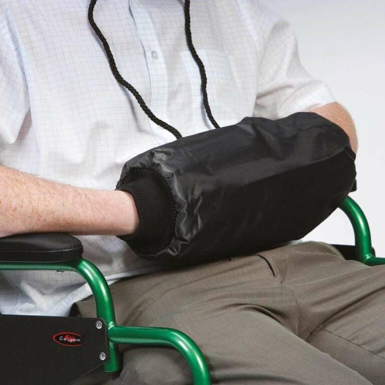 Handmuff Hand Warmer with a user within their hands in it sitting in a wheelchair.