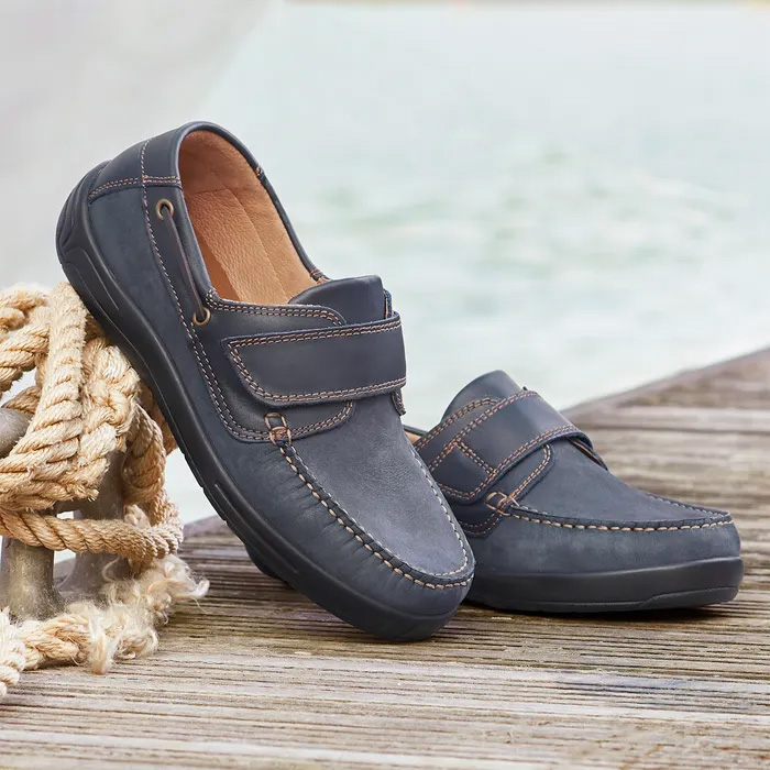 Cosyfeet Woody Navy boat shoes sitting on a dock.