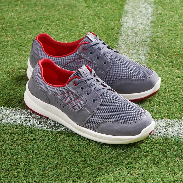 Cosyfeet Vasco Grey sitting on a white line of football pitch