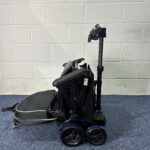 a wheelchair with wheels and a camera