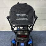 a black bag on a blue and black wheeled vehicle