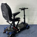 a scooter with a backpack on it