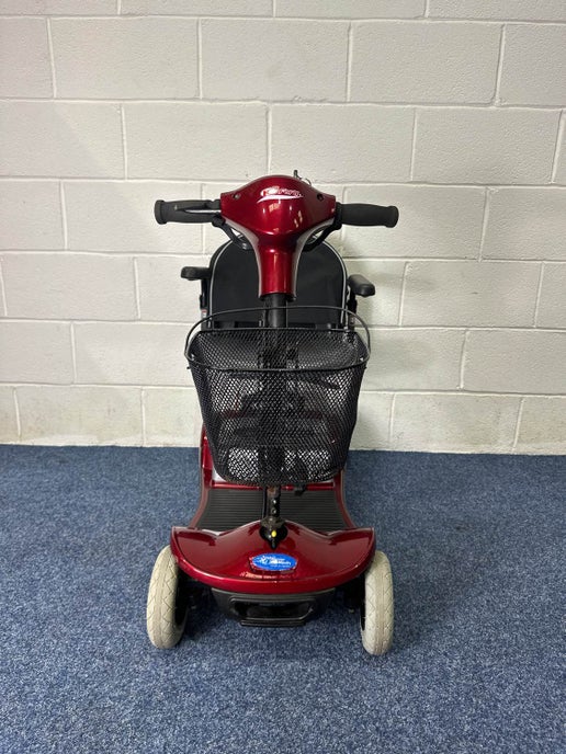 a scooter with basket on the front