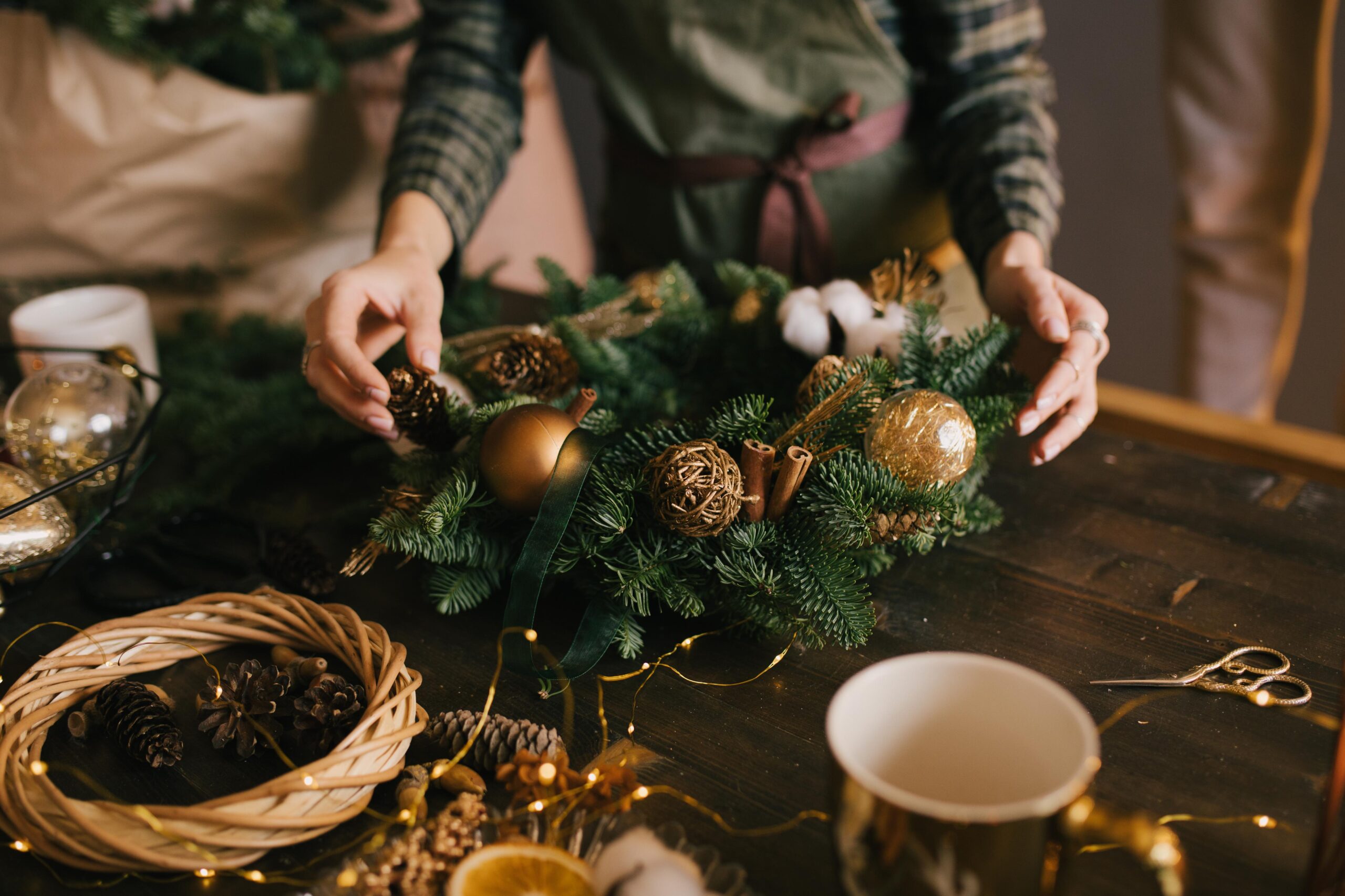Person making a Festive wreath - Christmas 2024 events for over 65s in ilkeston