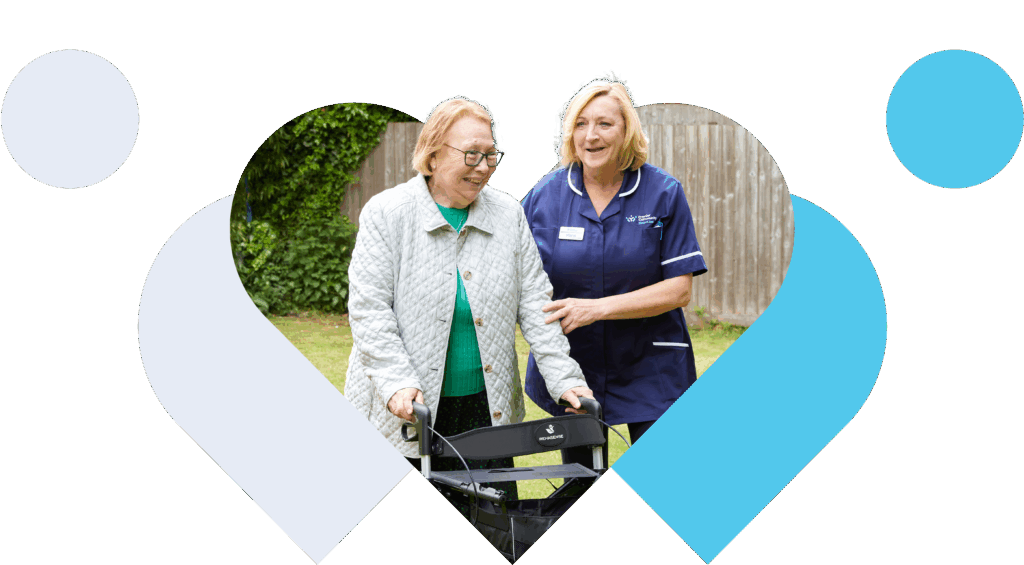 Walking aid in a garden with carer
